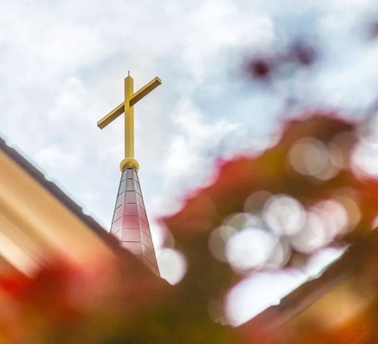 Regent University chapel steeple with a cross