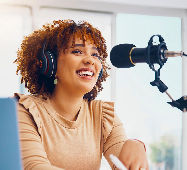 Regent University student at a microphone