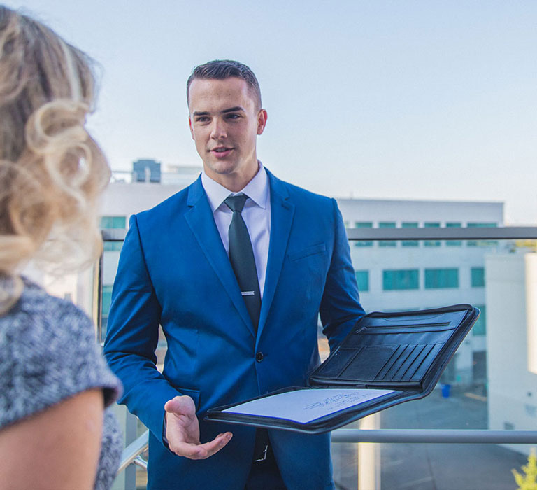 Regent business student talking to woman