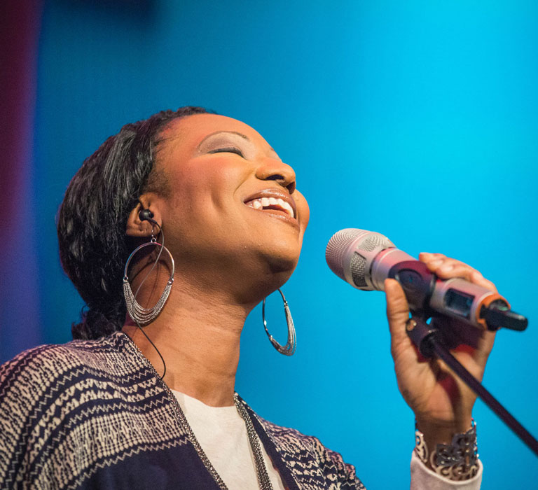 Woman leading worship songs