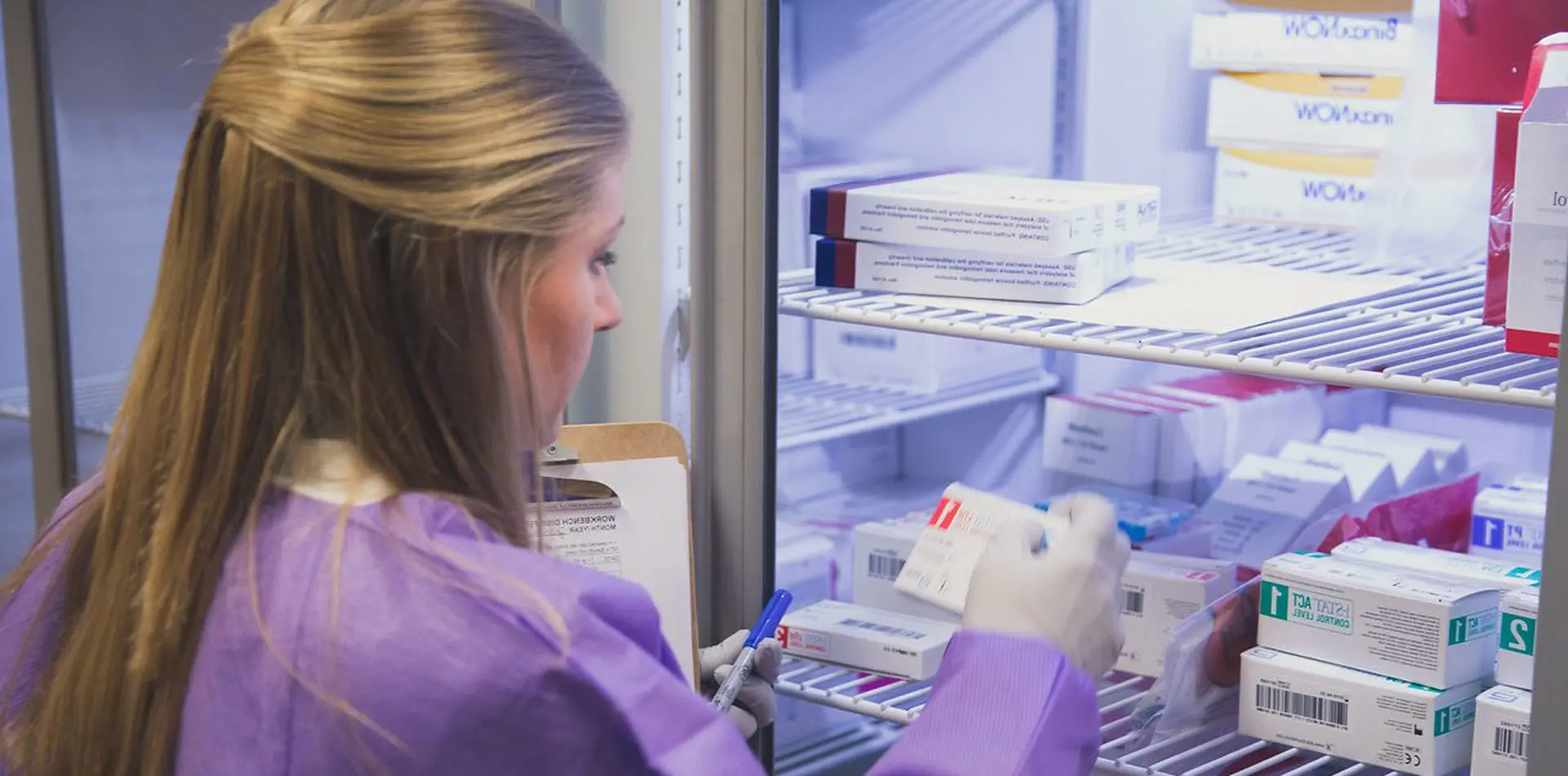 Woman looking at medication
