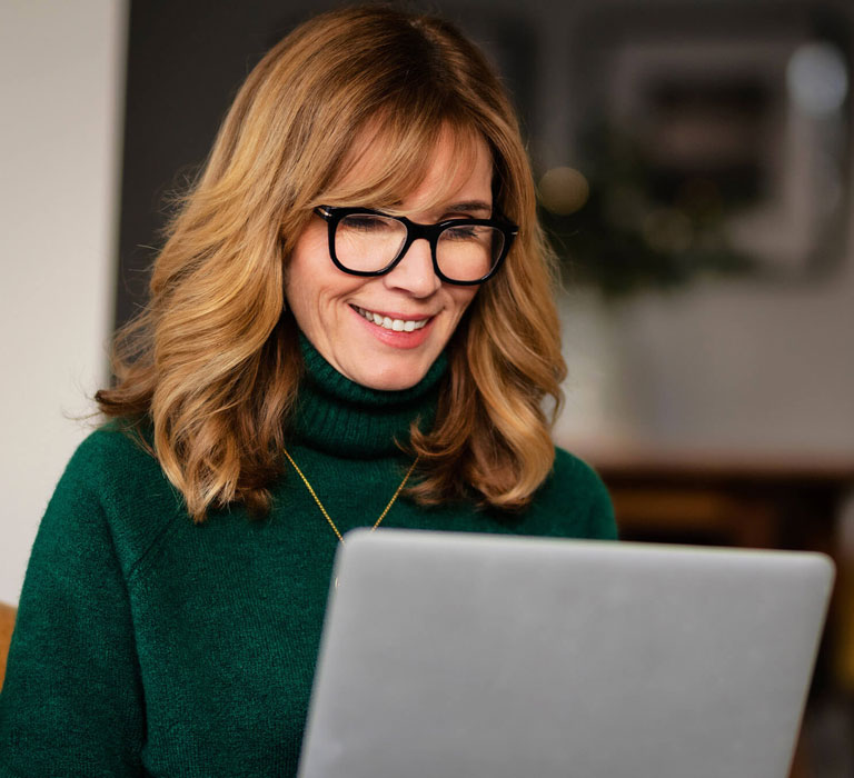 Woman looking at laptop