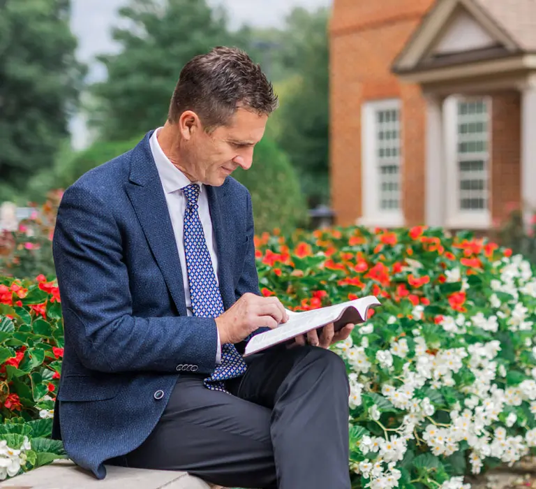 Regent student studying on campus.