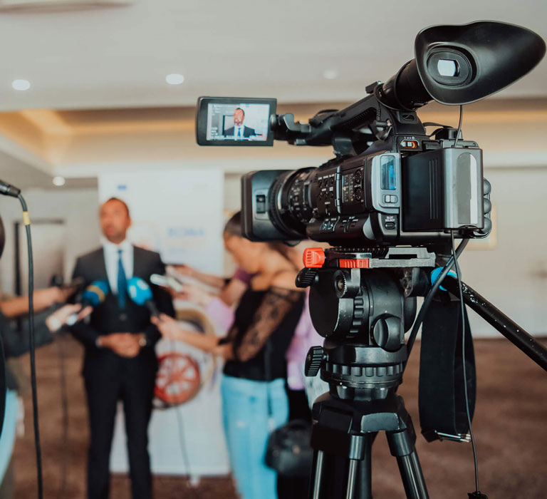 mfa-film-television-video-production-desktop Camera equipment filming a scene on a TV set.